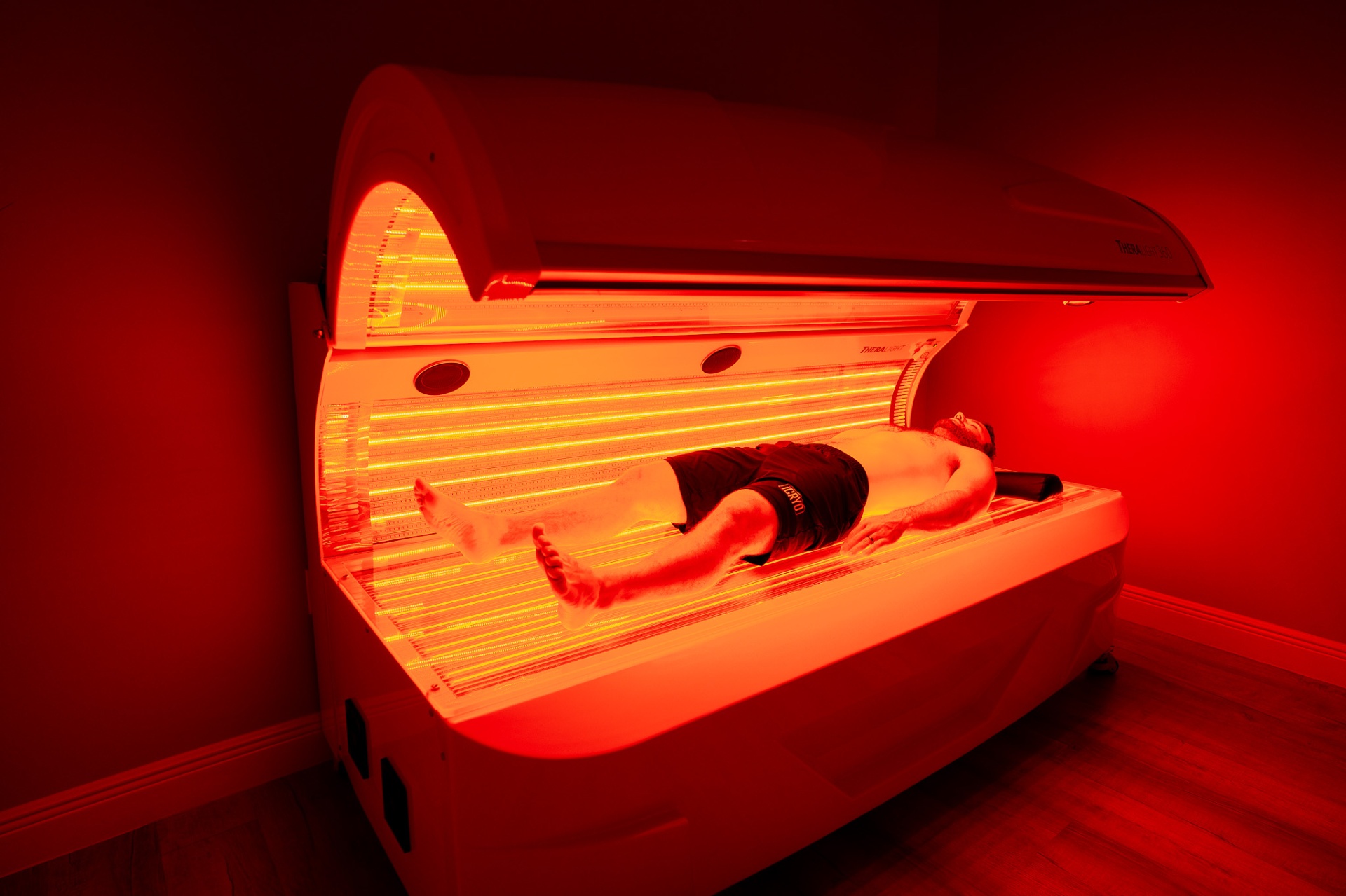 Woman receiving professional red light therapy treatment for skin rejuvenation